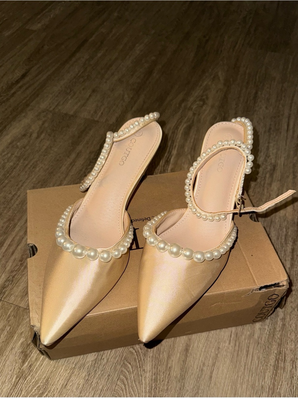 Coutgo satin, pearl kitten heels.